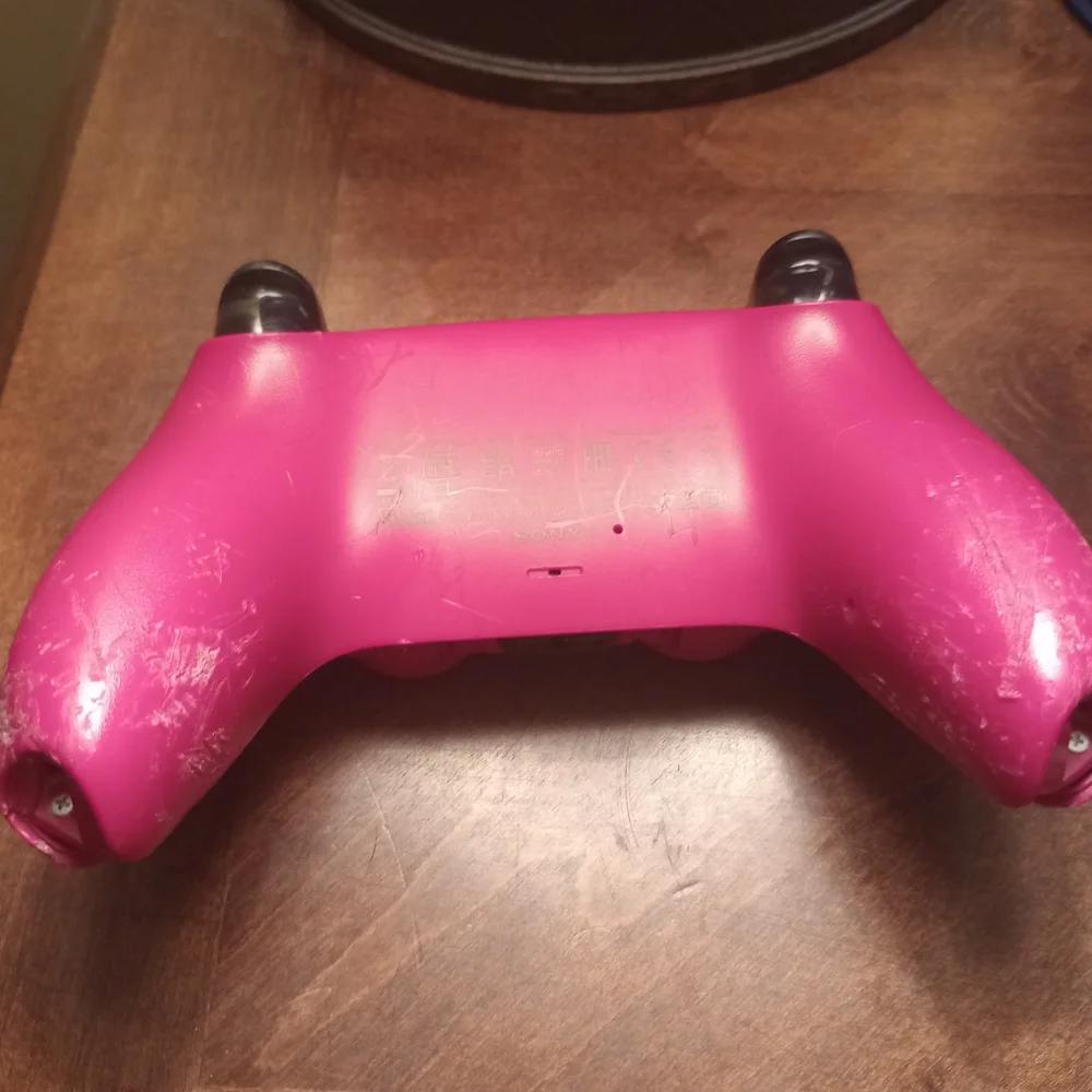 Gray and Pink Video Game Controllers